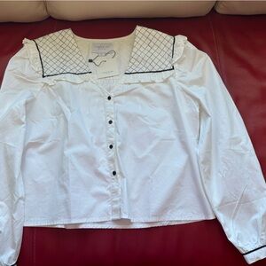 The Shirt by Rochelle Behrens - white with black quilted trim on a sailor collar
